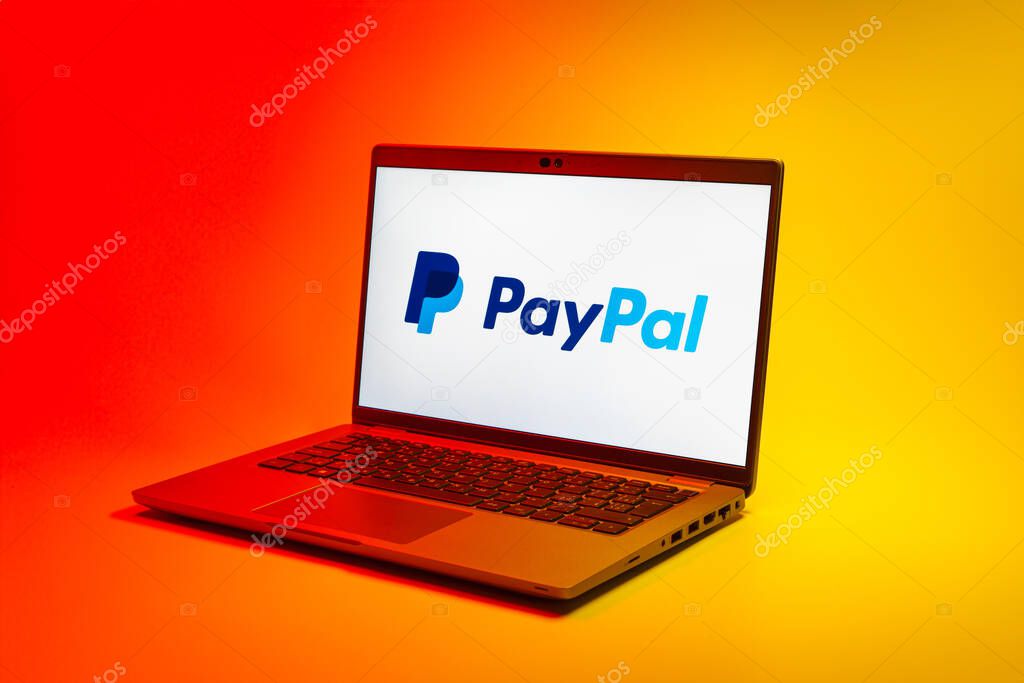Prague, Czechia - 02 21 2025: Laptop on surface showing PayPal logo.