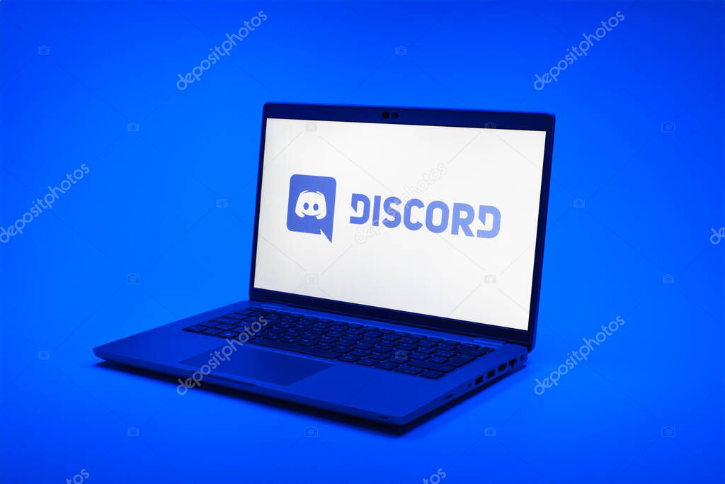 Prague, Czechia - 02 21 2025: Laptop on surface showing Discord logo.