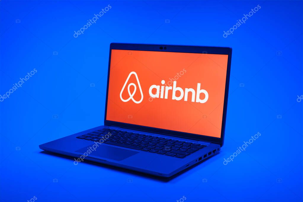 Prague, Czechia - 02 21 2025: Laptop on surface showing Airbnb logo.