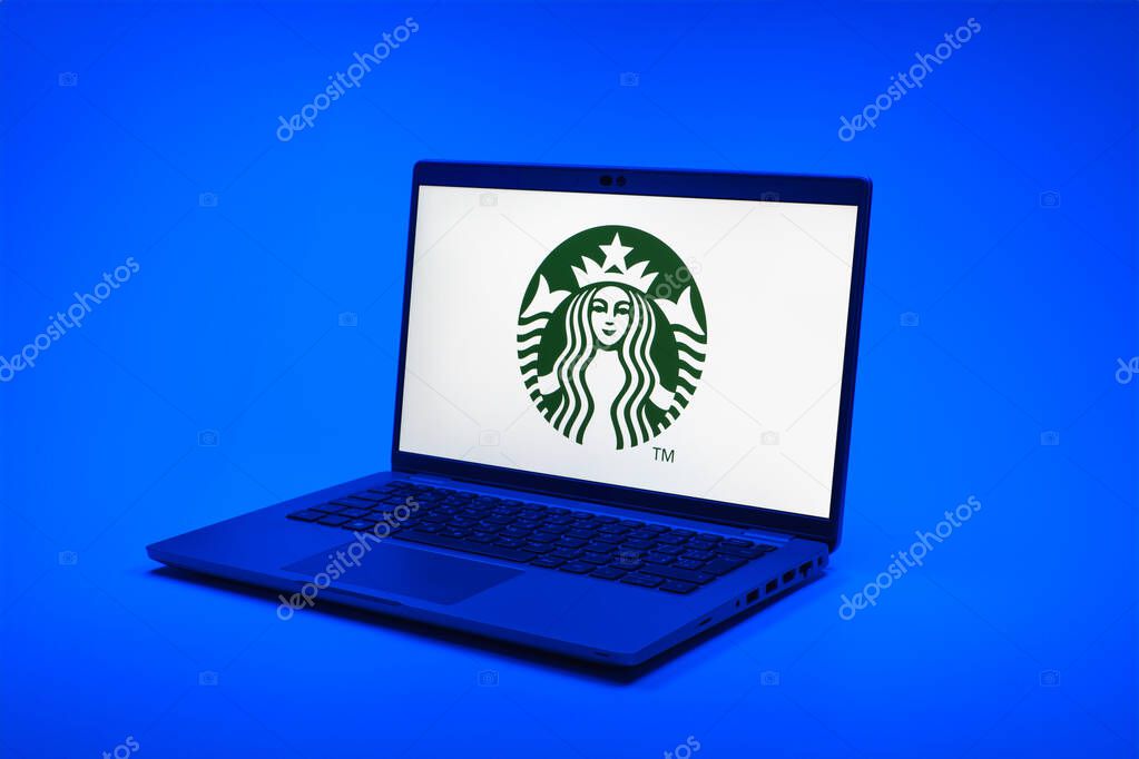 Prague, Czechia - 02 21 2025: Laptop on surface showing Starbucks logo.