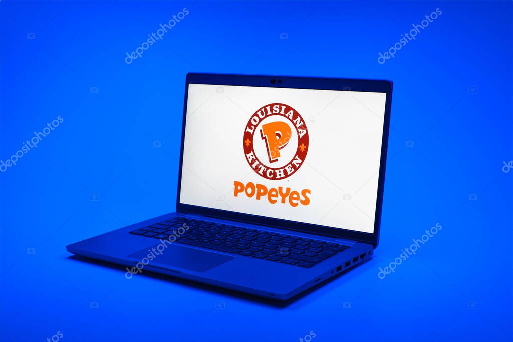 Prague, Czechia - 02 21 2025: Laptop on surface showing Popeyes logo.