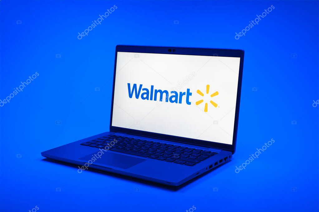Prague, Czechia - 02 21 2025: Laptop on surface showing Walmart logo.