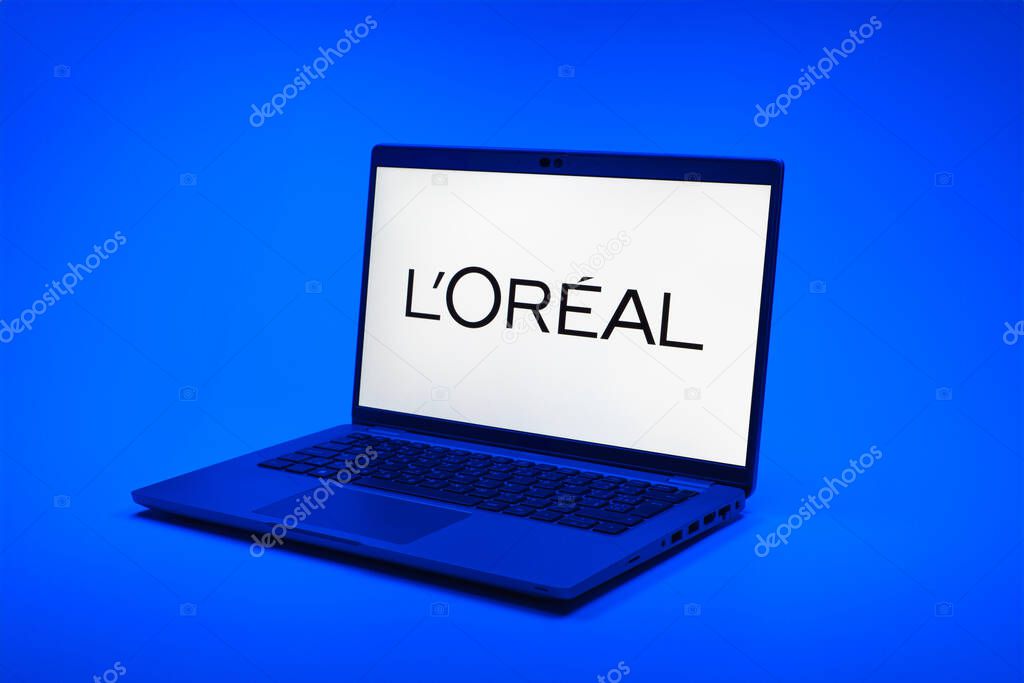 Prague, Czechia - 02 21 2025: Laptop on surface showing L'Oreal logo.
