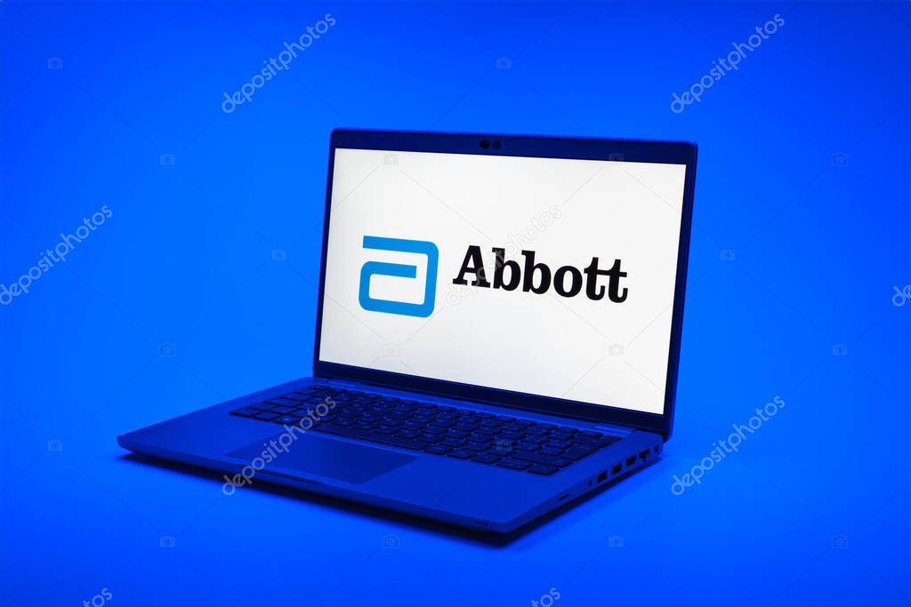 Prague, Czechia - 02 21 2025: Laptop on surface showing Abbott Laboratories logo.