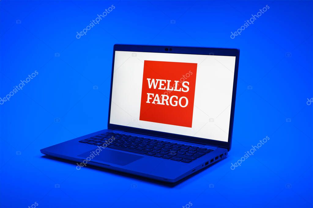 Prague, Czechia - 02 21 2025: Laptop on surface showing Wells Fargo logo.