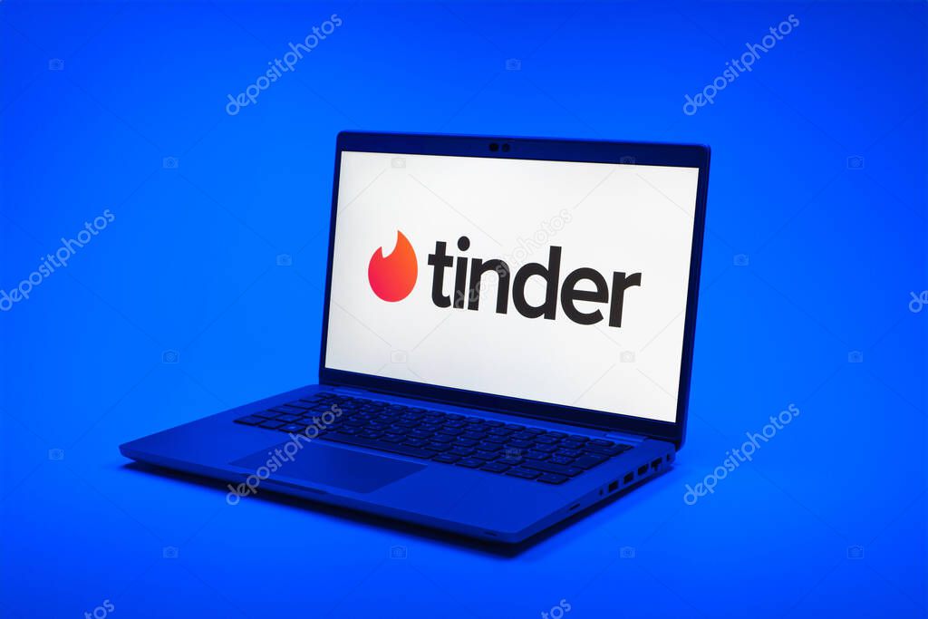 Prague, Czechia - 02 21 2025: Laptop on surface showing Tinder logo.