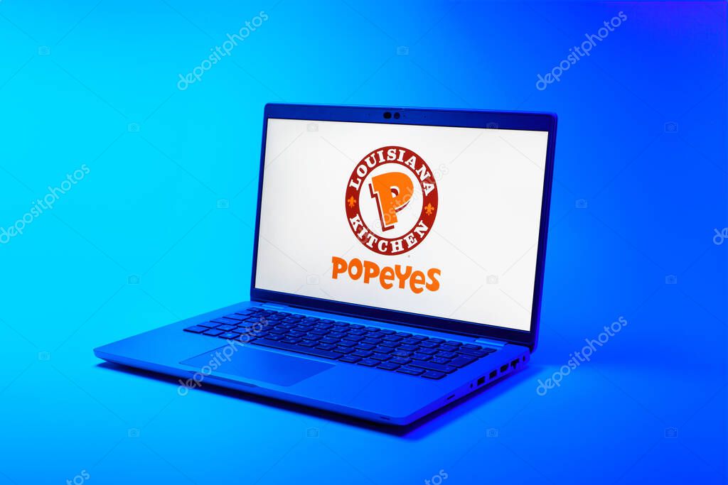 Prague, Czechia - 02 21 2025: Laptop on surface showing Popeyes logo.