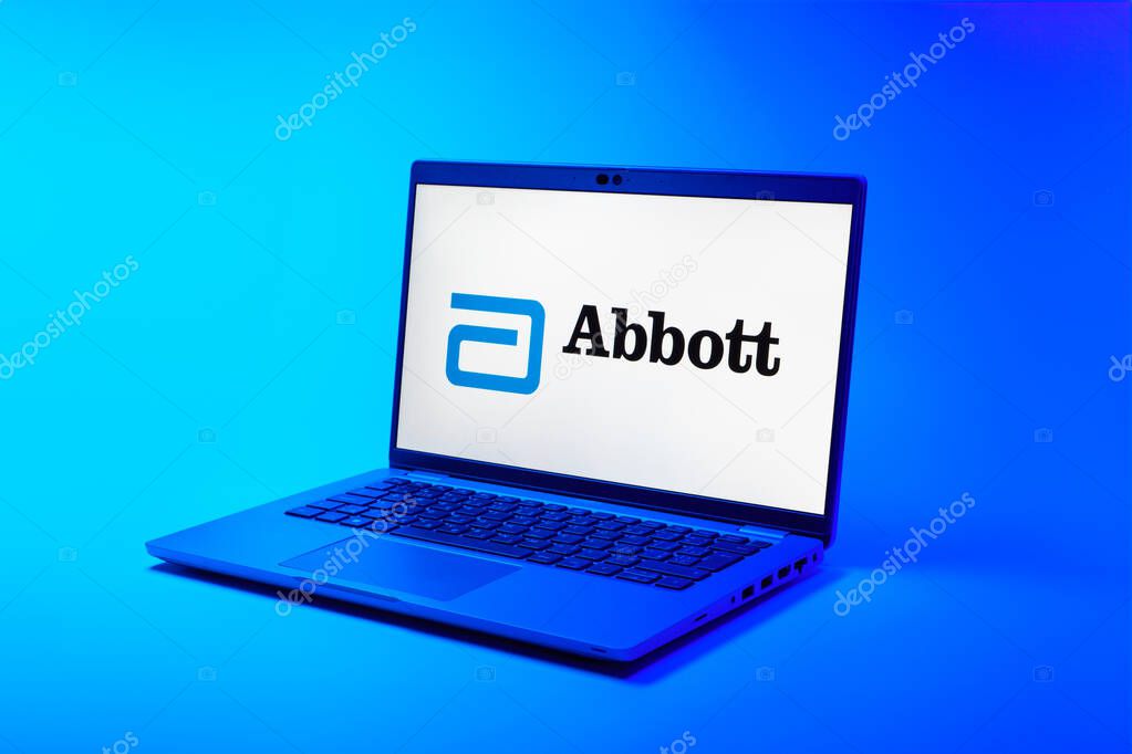 Prague, Czechia - 02 21 2025: Laptop on surface showing Abbott Laboratories logo.