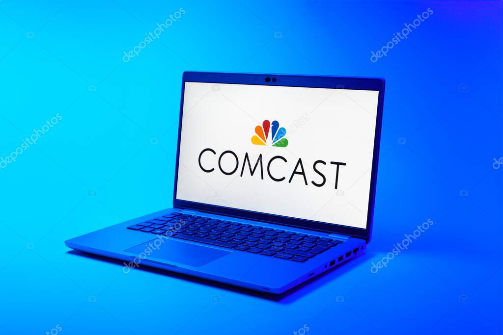 Prague, Czechia - 02 21 2025: Laptop on surface showing Comcast logo.