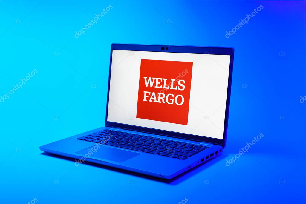 Prague, Czechia - 02 21 2025: Laptop on surface showing Wells Fargo logo.