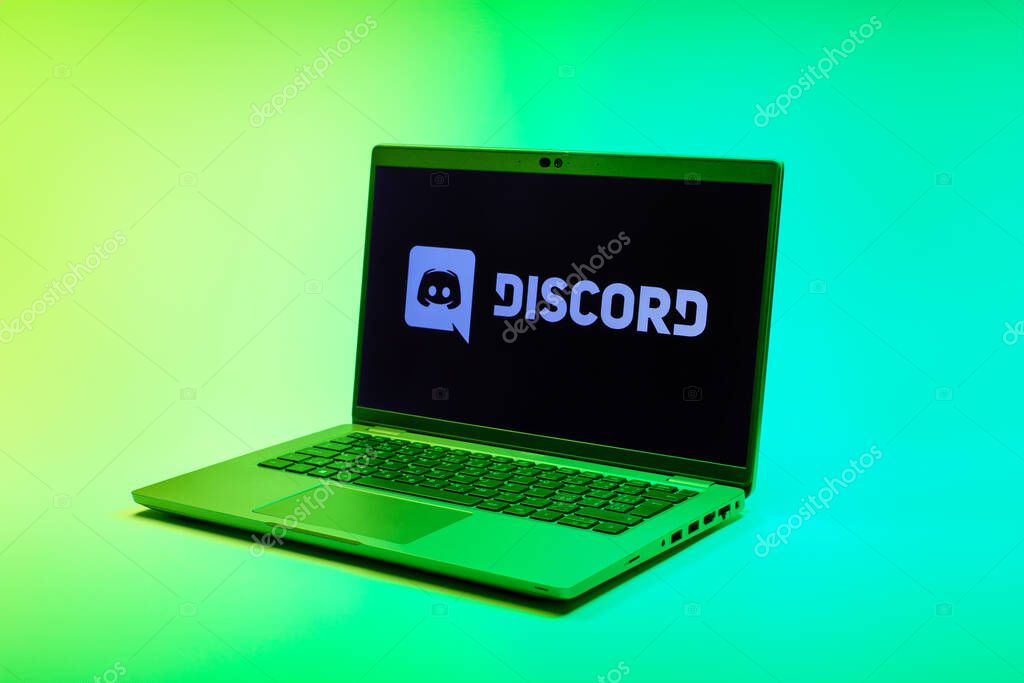 Prague, Czechia - 02 21 2025: Laptop on surface showing Discord logo.