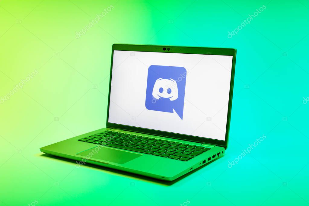 Prague, Czechia - 02 21 2025: Laptop on surface showing Discord logo.
