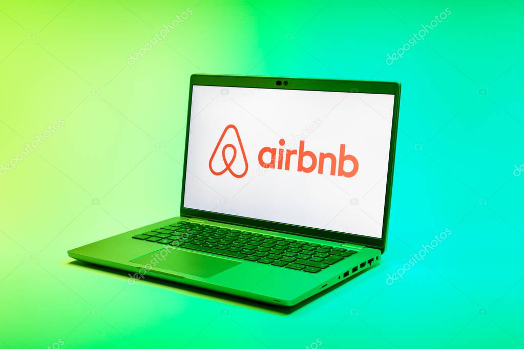 Prague, Czechia - 02 21 2025: Laptop on surface showing Airbnb logo.