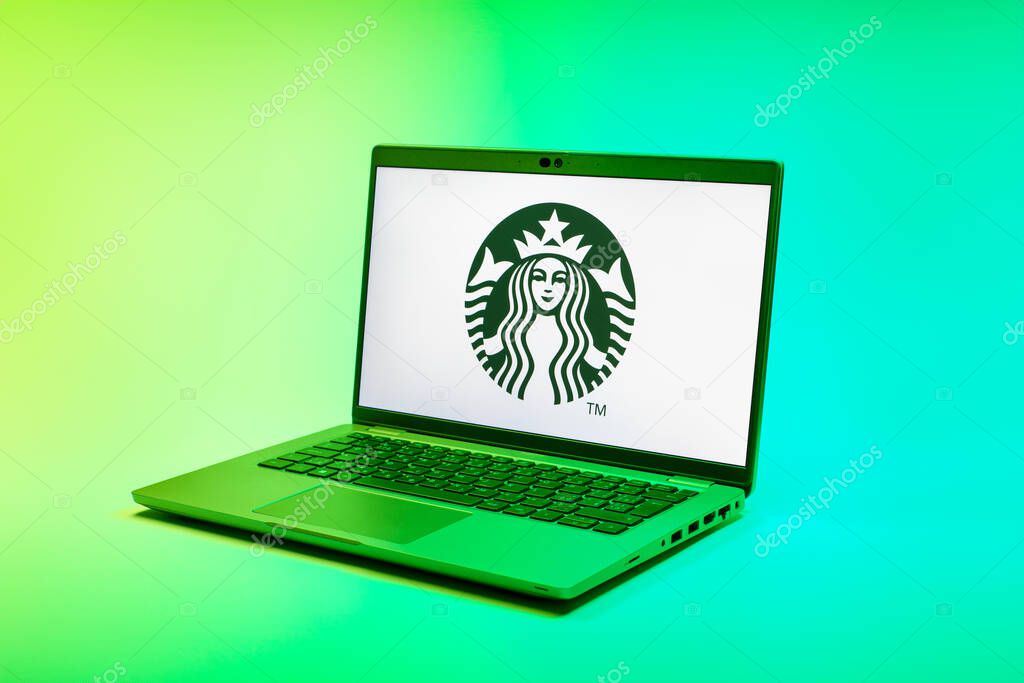 Prague, Czechia - 02 21 2025: Laptop on surface showing Starbucks logo.
