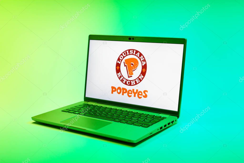 Prague, Czechia - 02 21 2025: Laptop on surface showing Popeyes logo.