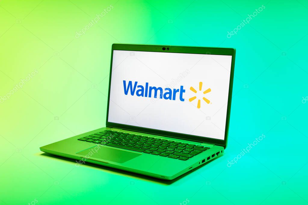 Prague, Czechia - 02 21 2025: Laptop on surface showing Walmart logo.