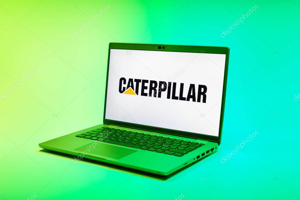 Prague, Czechia - 02 21 2025: Laptop on surface showing Caterpillar logo.
