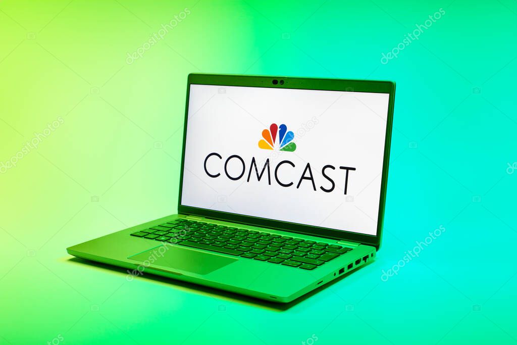 Prague, Czechia - 02 21 2025: Laptop on surface showing Comcast logo.