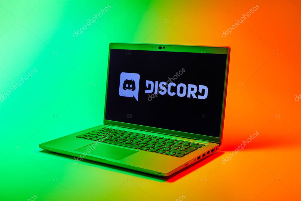 Prague, Czechia - 02 21 2025: Laptop on surface showing Discord logo.