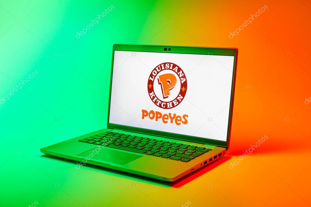 Prague, Czechia - 02 21 2025: Laptop on surface showing Popeyes logo.