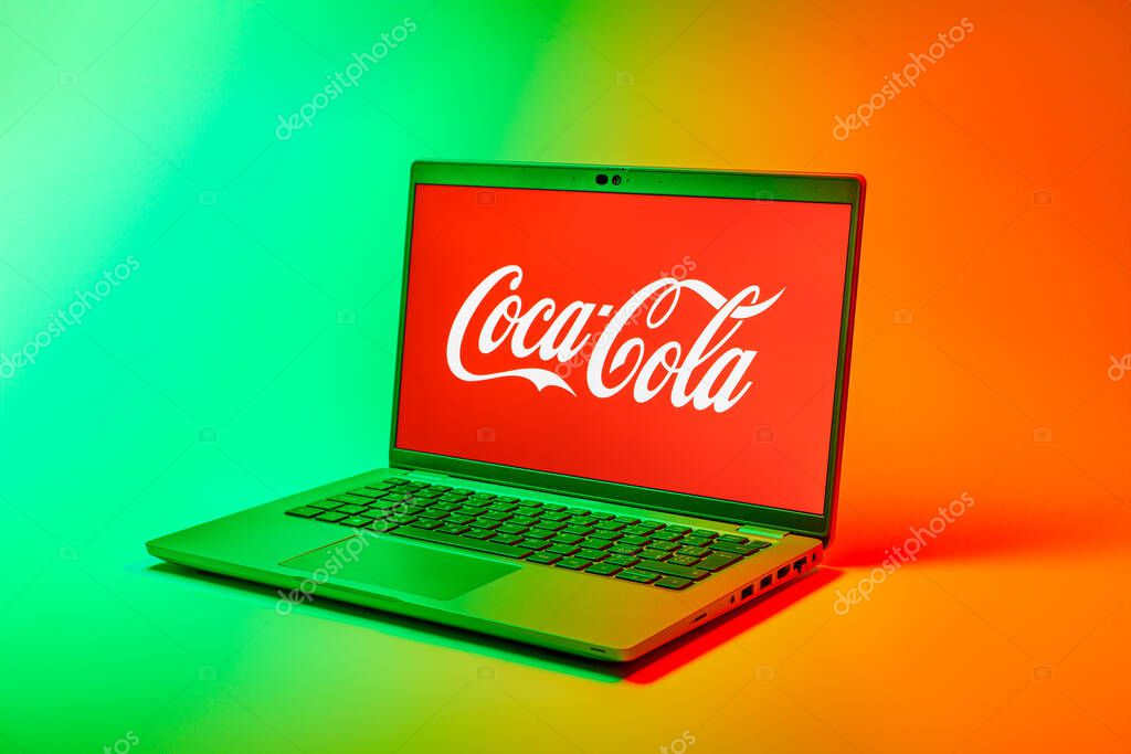 Prague, Czechia - 02 21 2025: Laptop on surface showing Coca-Cola logo.