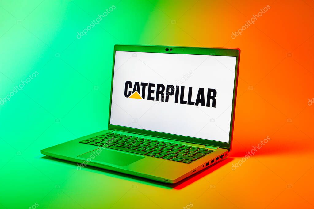 Prague, Czechia - 02 21 2025: Laptop on surface showing Caterpillar logo.