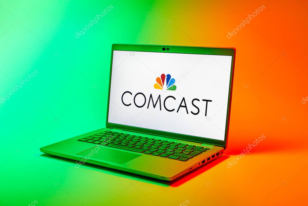 Prague, Czechia - 02 21 2025: Laptop on surface showing Comcast logo.