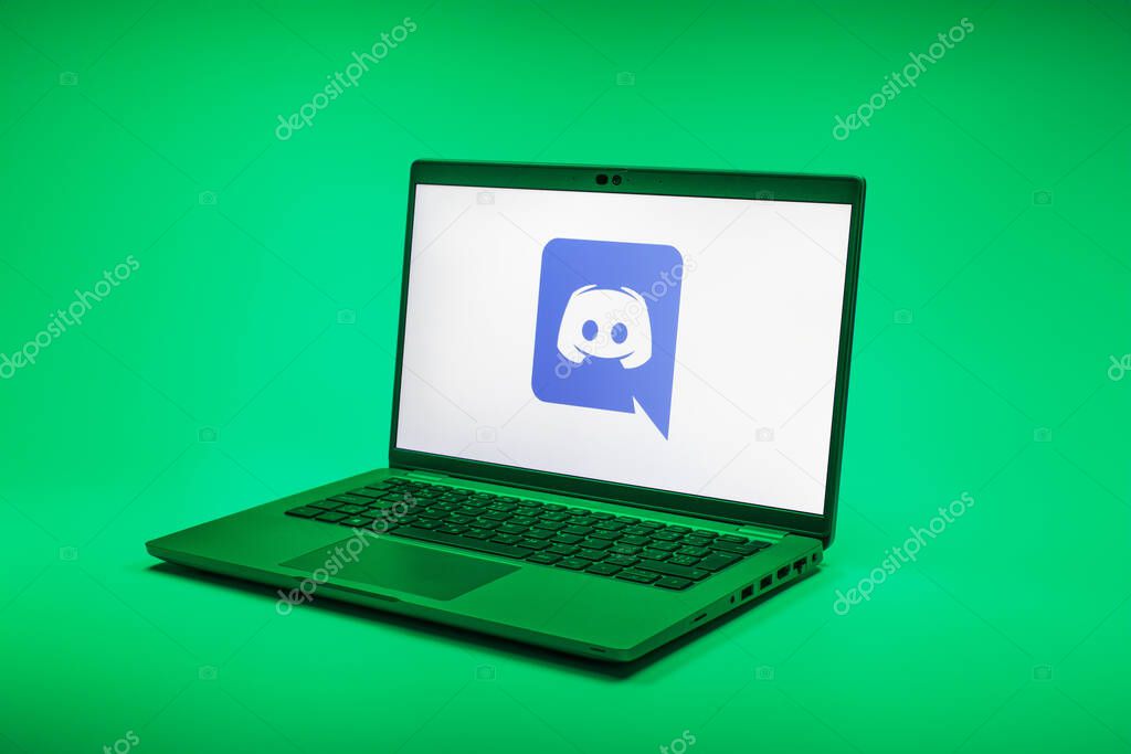 Prague, Czechia - 02 21 2025: Laptop on surface showing Discord logo.