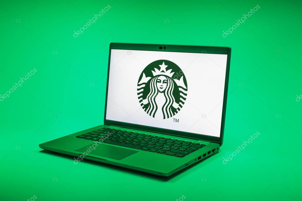 Prague, Czechia - 02 21 2025: Laptop on surface showing Starbucks logo.