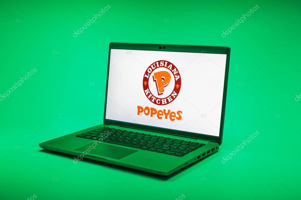 Prague, Czechia - 02 21 2025: Laptop on surface showing Popeyes logo.