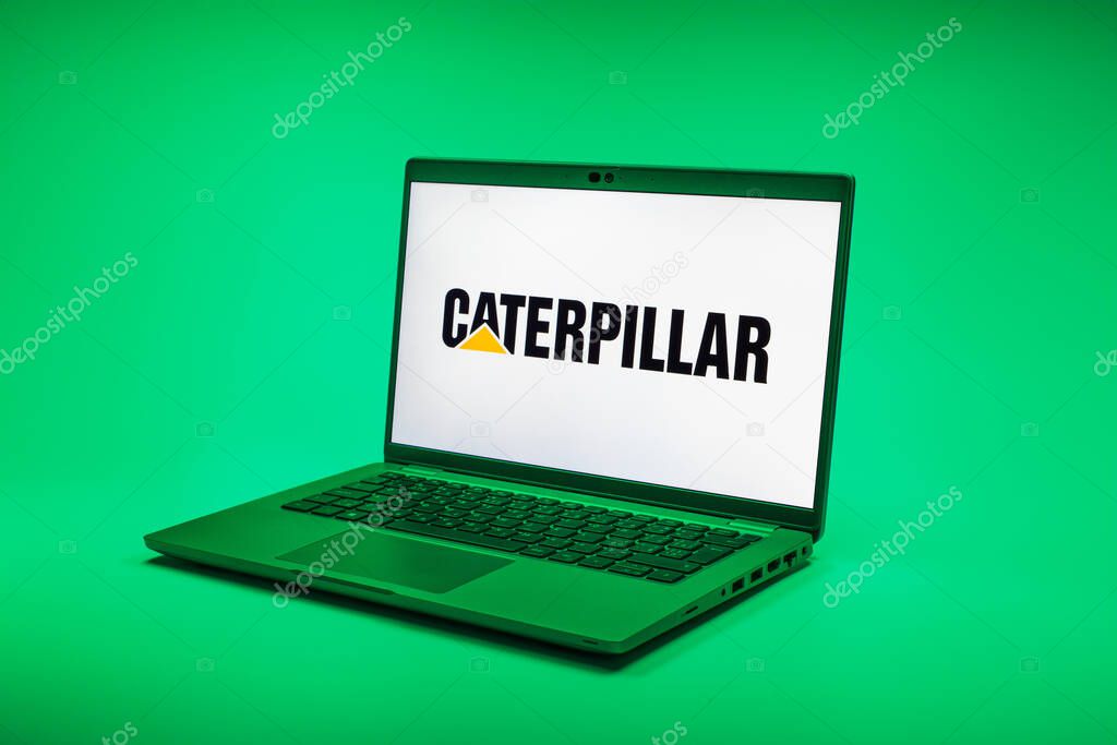 Prague, Czechia - 02 21 2025: Laptop on surface showing Caterpillar logo.