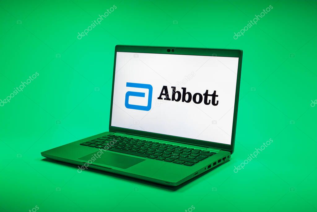 Prague, Czechia - 02 21 2025: Laptop on surface showing Abbott Laboratories logo.