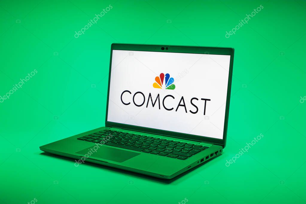 Prague, Czechia - 02 21 2025: Laptop on surface showing Comcast logo.