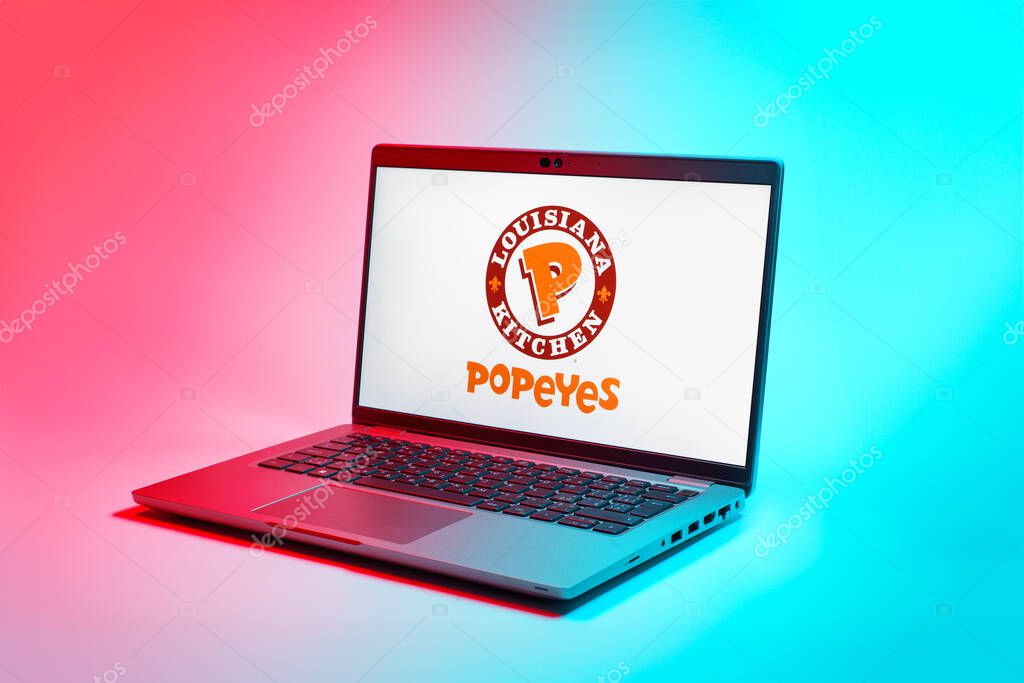 Prague, Czechia - 02 21 2025: Laptop on surface showing Popeyes logo.