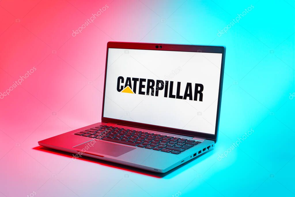 Prague, Czechia - 02 21 2025: Laptop on surface showing Caterpillar logo.