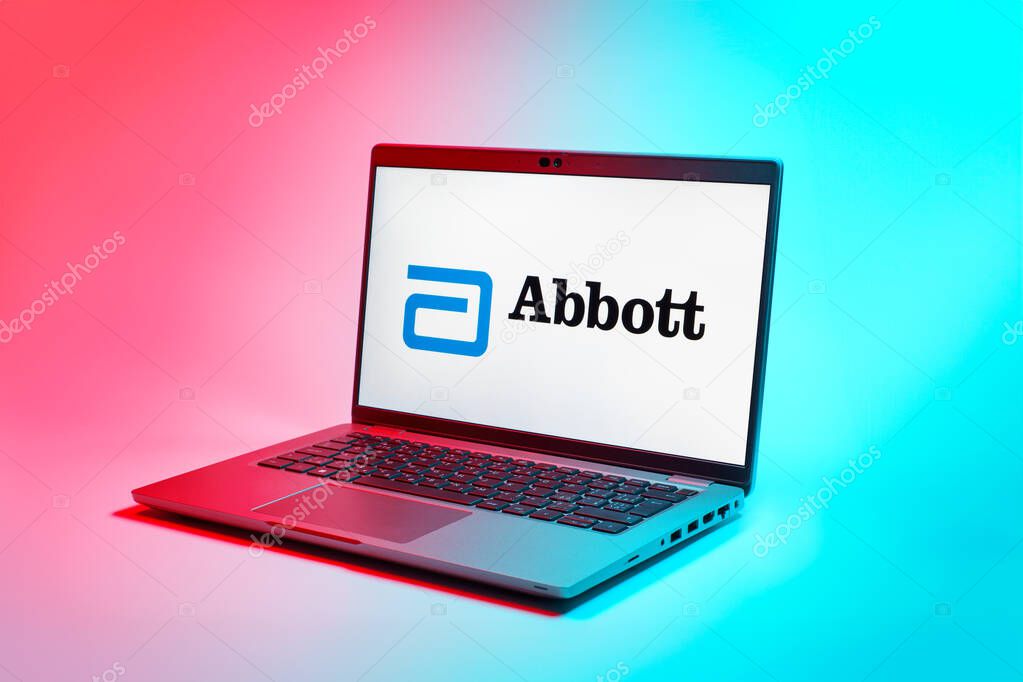 Prague, Czechia - 02 21 2025: Laptop on surface showing Abbott Laboratories logo.