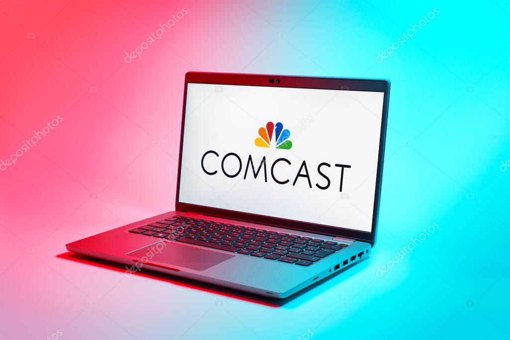 Prague, Czechia - 02 21 2025: Laptop on surface showing Comcast logo.