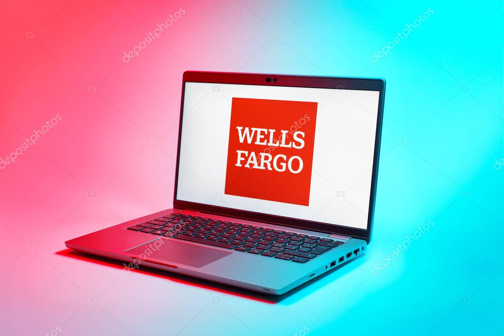 Prague, Czechia - 02 21 2025: Laptop on surface showing Wells Fargo logo.
