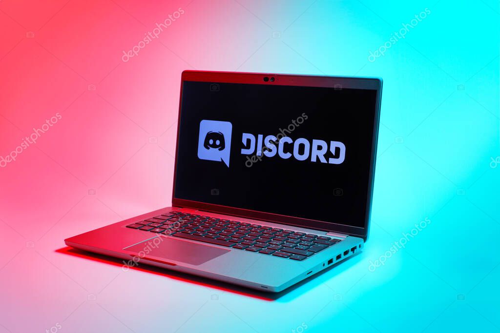 Prague, Czechia - 02 21 2025: Laptop on surface showing Discord logo.