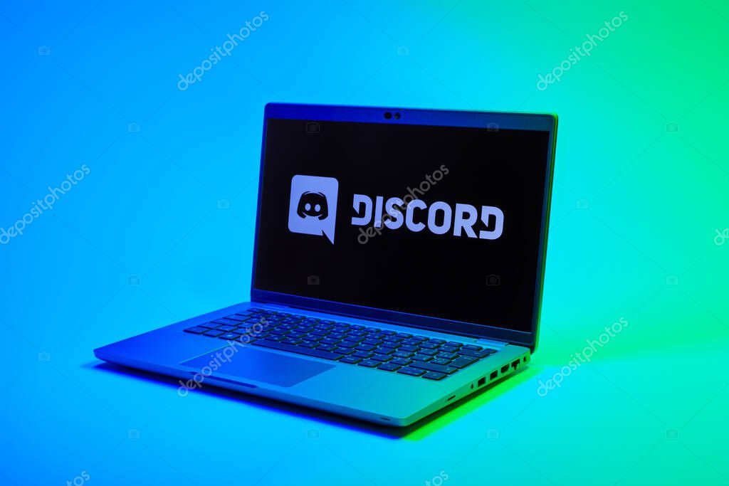 Prague, Czechia - 02 21 2025: Laptop on surface showing Discord logo.