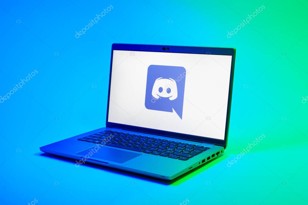 Prague, Czechia - 02 21 2025: Laptop on surface showing Discord logo.