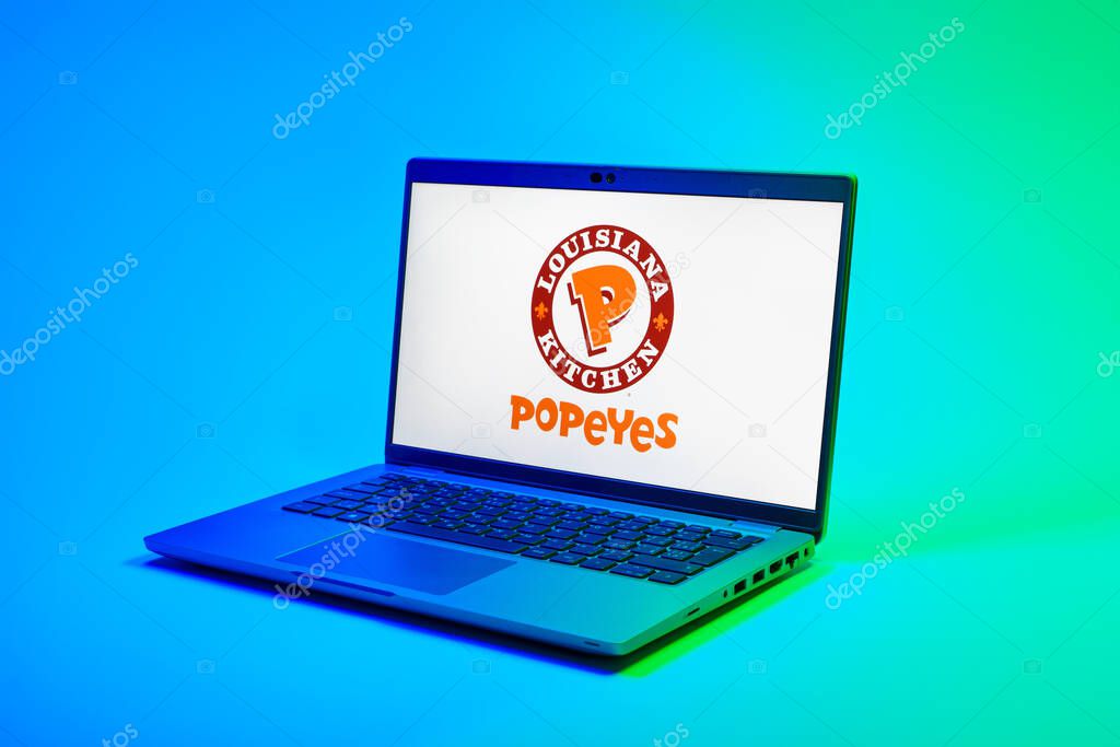 Prague, Czechia - 02 21 2025: Laptop on surface showing Popeyes logo.