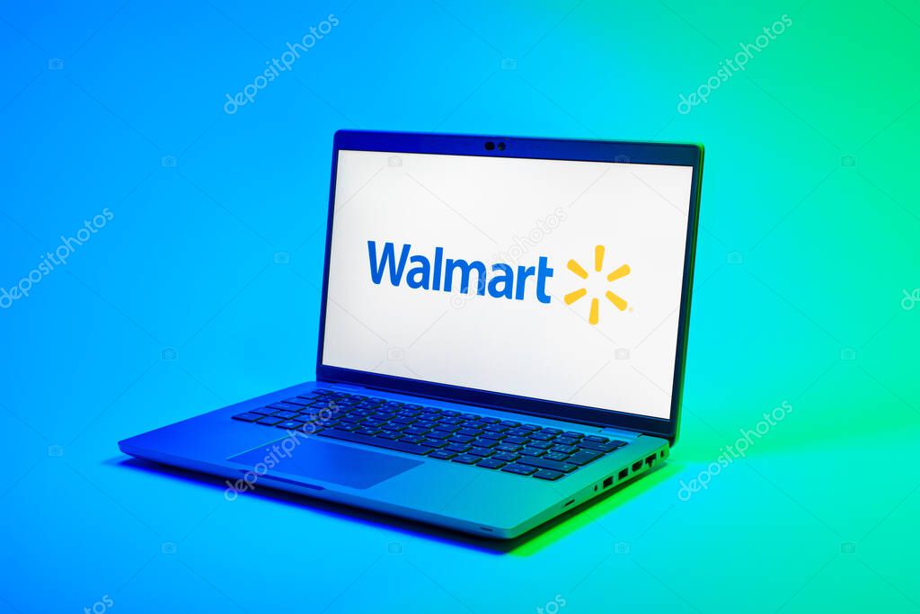 Prague, Czechia - 02 21 2025: Laptop on surface showing Walmart logo.
