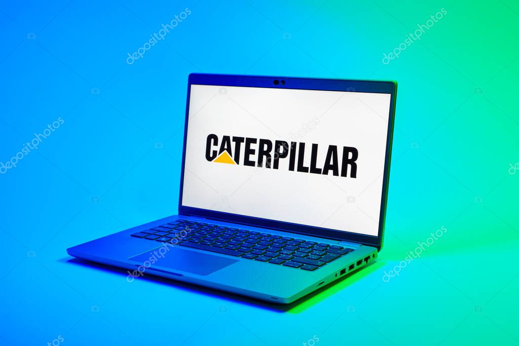 Prague, Czechia - 02 21 2025: Laptop on surface showing Caterpillar logo.