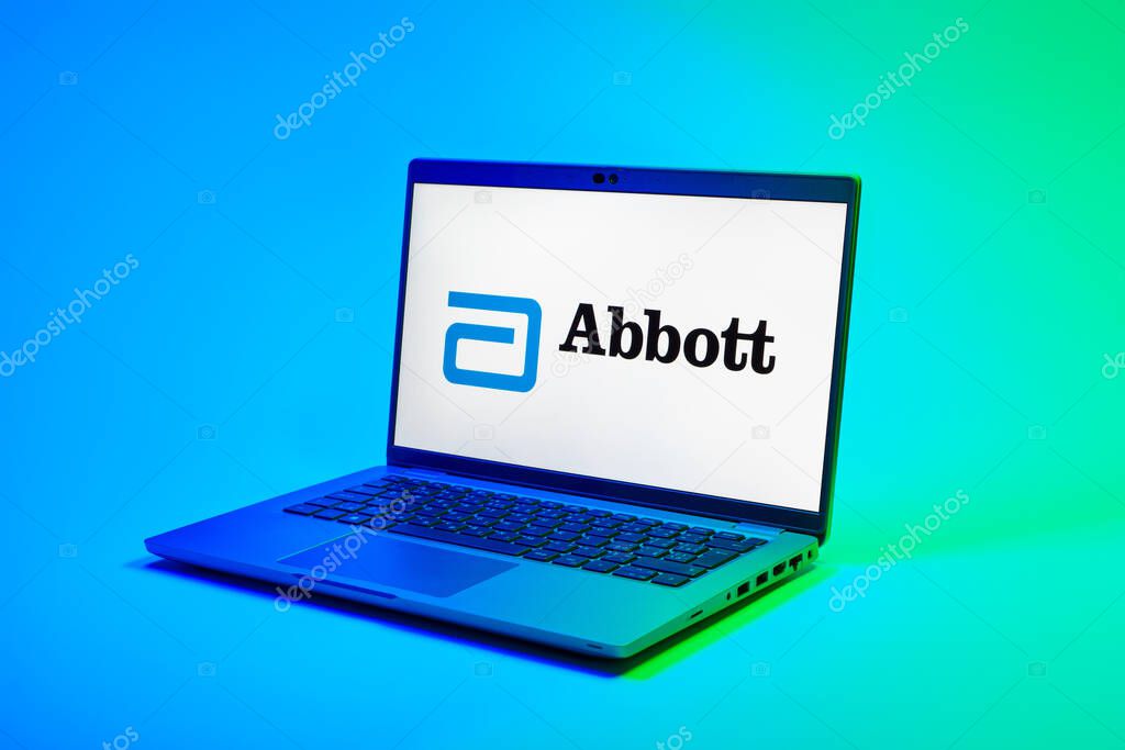 Prague, Czechia - 02 21 2025: Laptop on surface showing Abbott Laboratories logo.