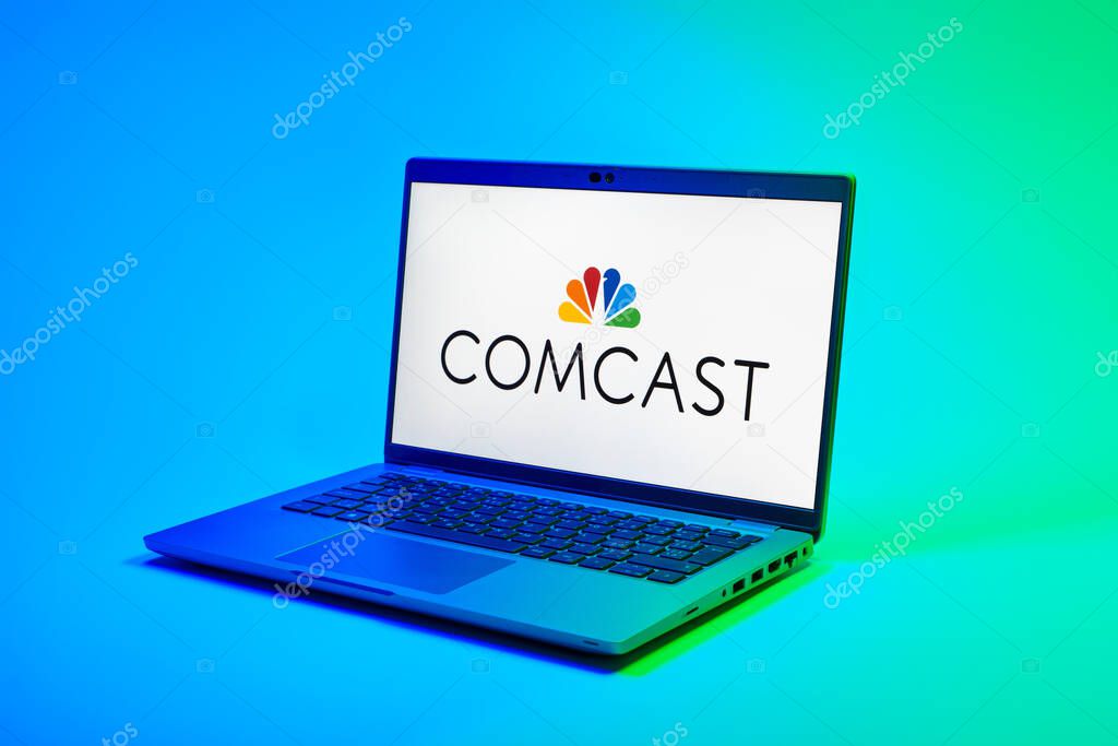 Prague, Czechia - 02 21 2025: Laptop on surface showing Comcast logo.