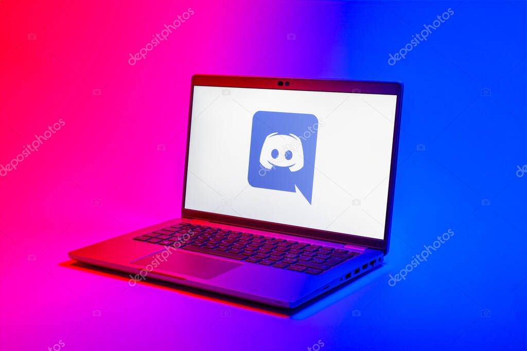 Prague, Czechia - 02 21 2025: Laptop on surface showing Discord logo.