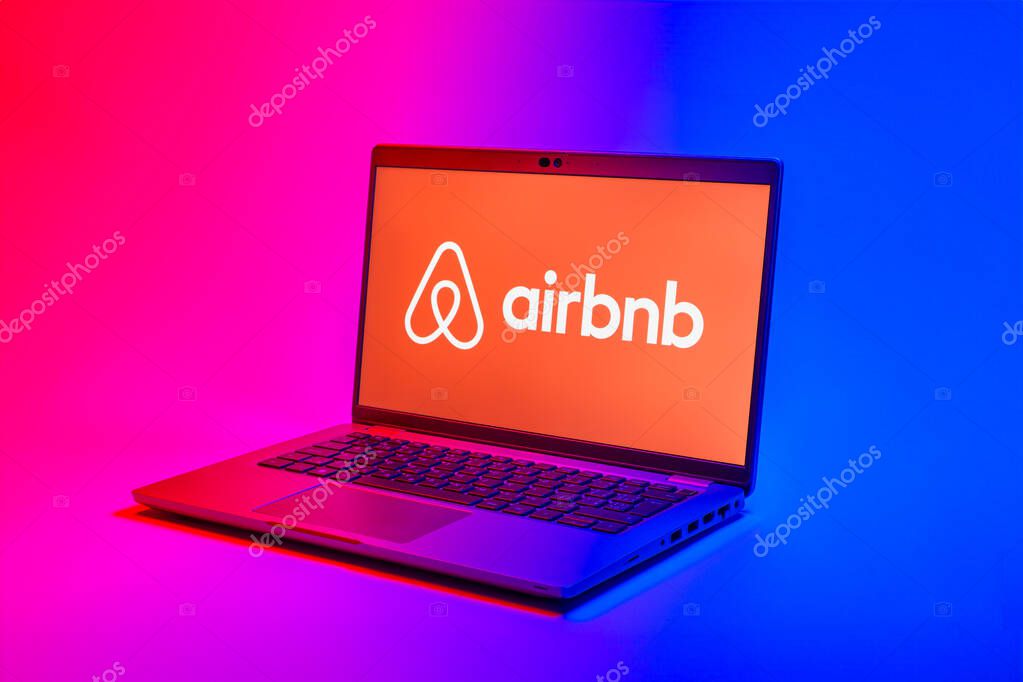 Prague, Czechia - 02 21 2025: Laptop on surface showing Airbnb logo.