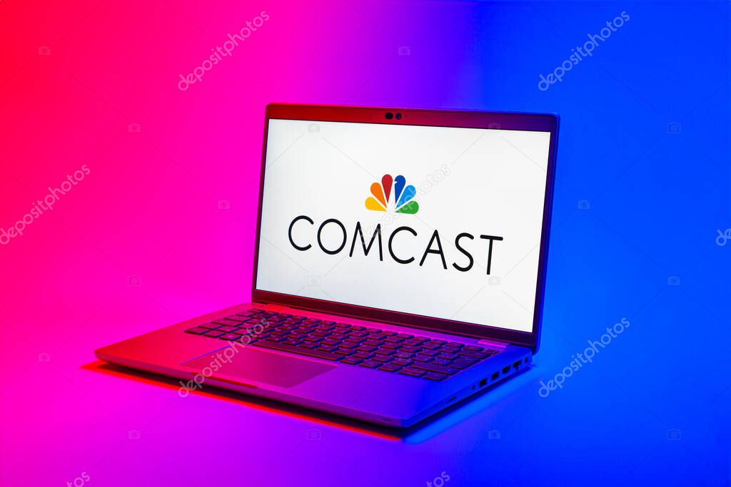 Prague, Czechia - 02 21 2025: Laptop on surface showing Comcast logo.