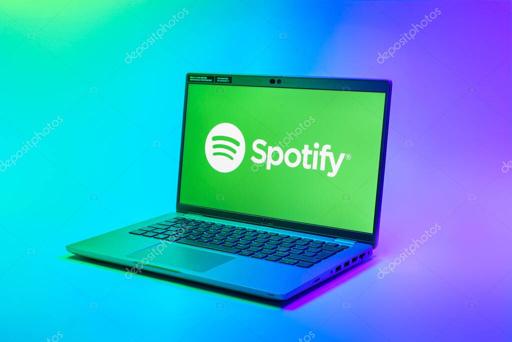 Prague, Czechia - 02 21 2025: Laptop on surface showing Spotify logo.